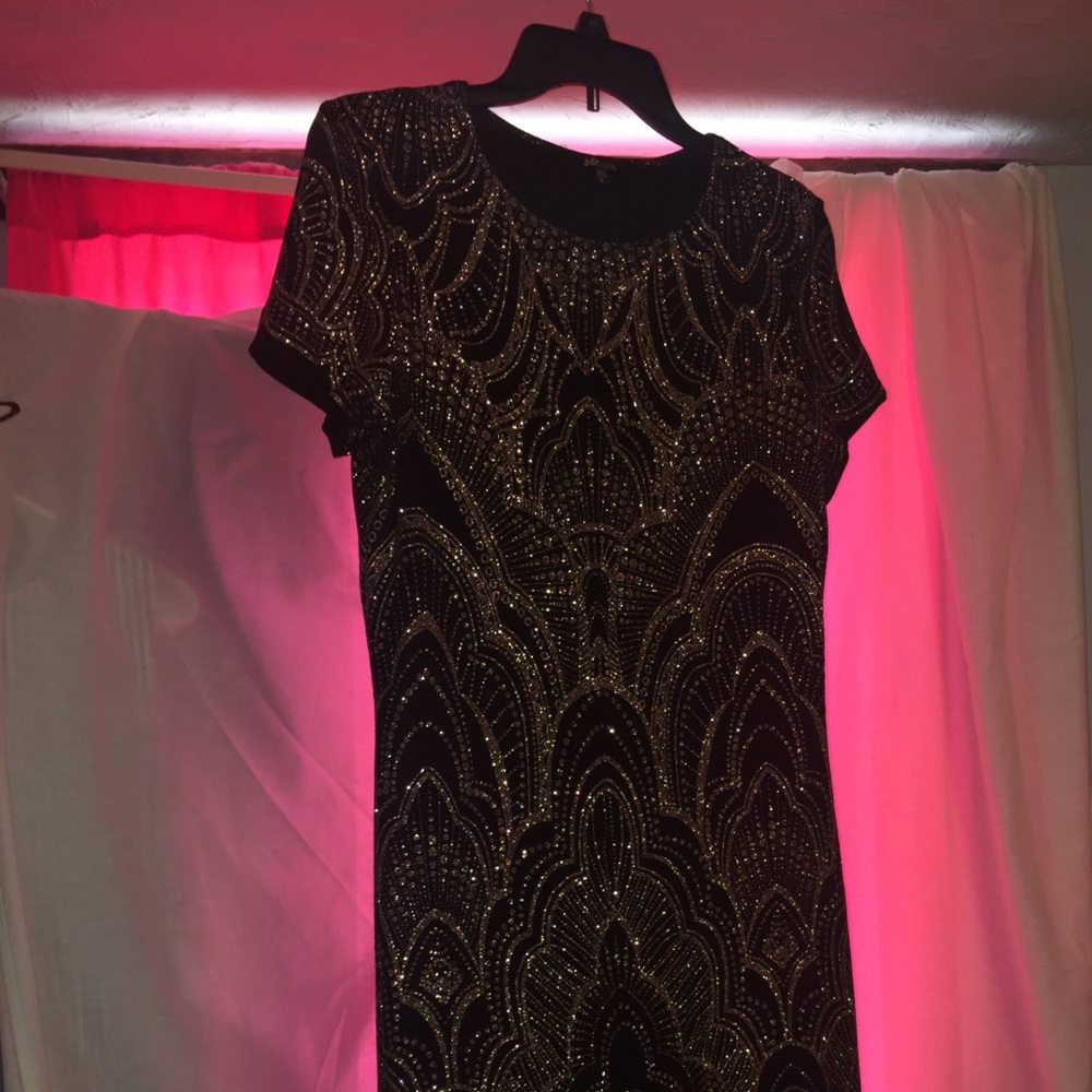 Sparkly rose gold, tight fitted, short black dress